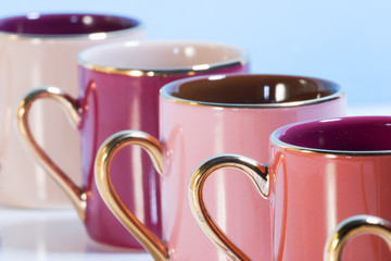 row of colorful coffee cups