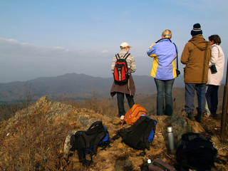 group of hiking people on the mountain top