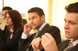 © endostock - group of business persons at a conference, man in