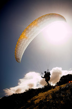 Paraglider Launching From The Mountain Ridge