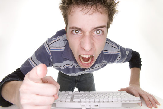 teenage boy angry at computer