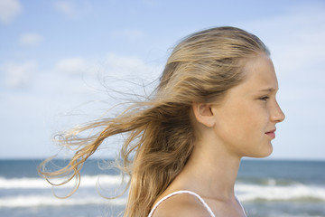 Portrait of pre-teen girl  with hair blowing.