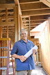 © iofoto - Caucasian man on construction site.
