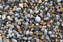 Close Up Of Colorful Stones On A Beach.