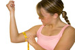 khollie measuring her bicep with tape measure