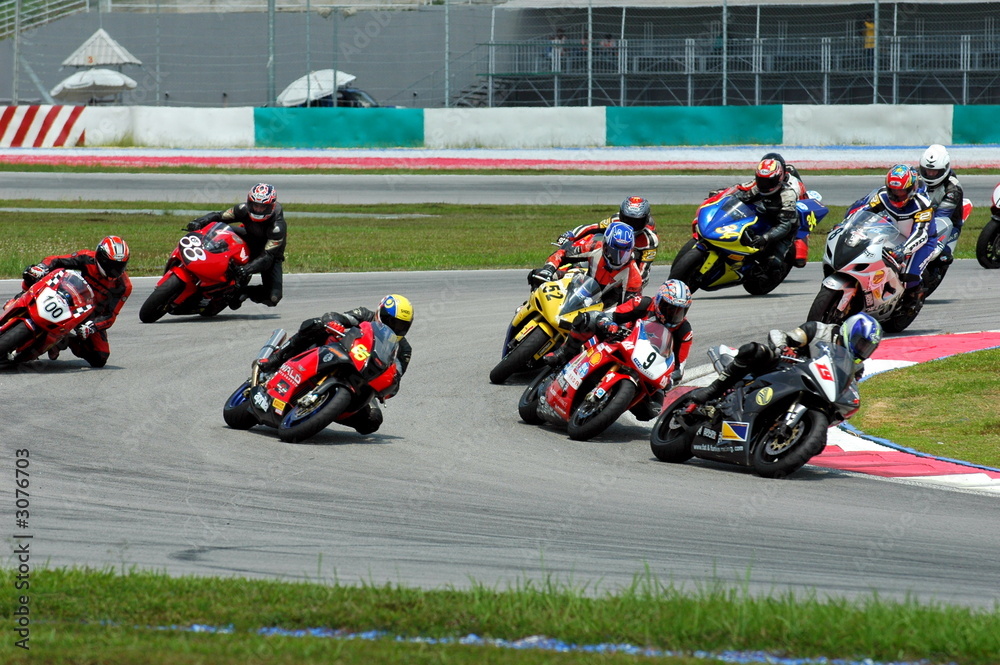 ภาพถ่าย Stock race bikes at a race track | Adobe Stock