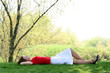 woman lying down in the park