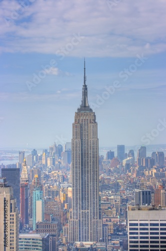 Fotografering empire state building and manhattan skyline, new y