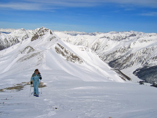 Wall Mural - woman mountain trekker with snow shoes,  les orres, alps, france