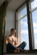 © Vladimir Wrangel - sexy muscular man on the window