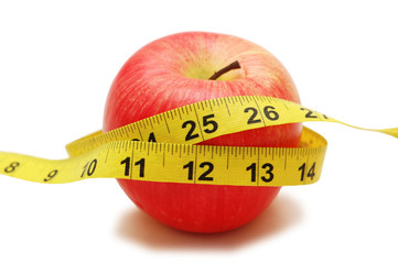 red apple and measuring tape  isolated on white