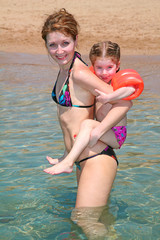 mother and daughter on a beach