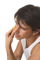 close up of young man shaving