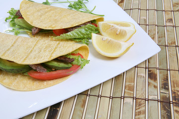 Two delicious looking tortilla tacos ready to eat