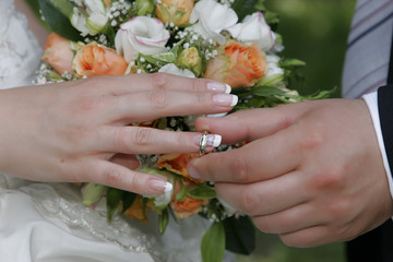 Poster - bride and groom changing wedding rings outdoors