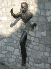 Man Goes Through Wall Sculpture