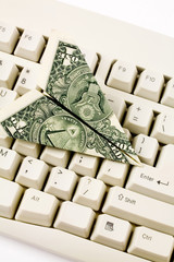 Sticker - dollar paper airplane and keyboard, business concept