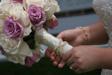 Wall Mural - hand holding flower bouquet pink ivory rose