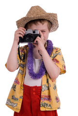 young boy dressed as a funny tropical tourist,