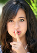 © Galina Barskaya - A pretty teenage girl doing be quiet gesture