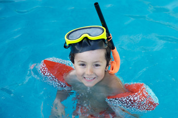 Poster - photo of an adorable boy learning to swim