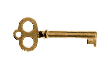 close-up of gold vintage key isolated on white background