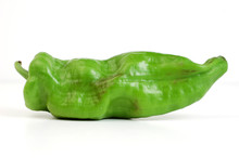 A Fresh Pepper On A White Background.