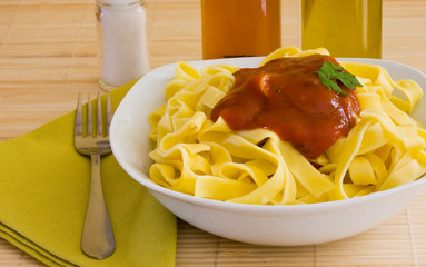 Canvas Print - Italian food pasta with tomato sauce on white bowl