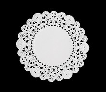 A Decorative Round Doily Isolated Over Black