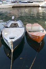 Two Old Boats Parked In The Water