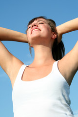 Wall Mural - Woman stretching in sunlight