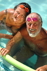 Wall Mural - senior couple swimming together