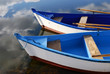 Small white and blue wooden boats
