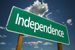 Independence Road Sign with blue sky and clouds.