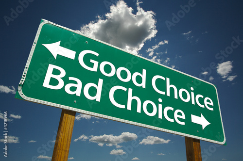 Fotografie, Obraz Good Choice, Bad Choice Road Sign with blue sky and clouds.