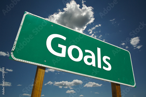 Fotografie, Obraz Goals Road Sign with blue sky and clouds.