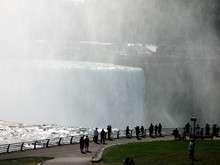 Tourists At The Falls Looking At Canada