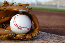Baseball & Glove On Baseball Field