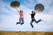 Jumping Girls With Umbrellas