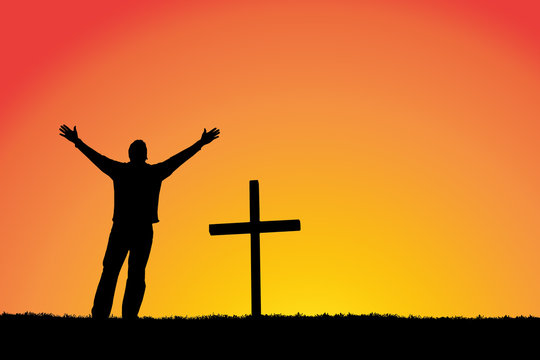 Silhouette of man and cross at sunset.