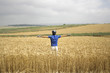 © paul prescott - cyclist standing up in a hay field