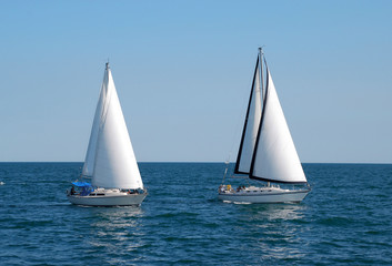 two sailboats on a summer day