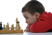 Adorable Little Boy Playing Chess