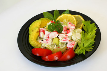 Canvas Print - Surimi and celery salad on the black plate