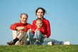© Pavel Losevsky - family sitting on the grass