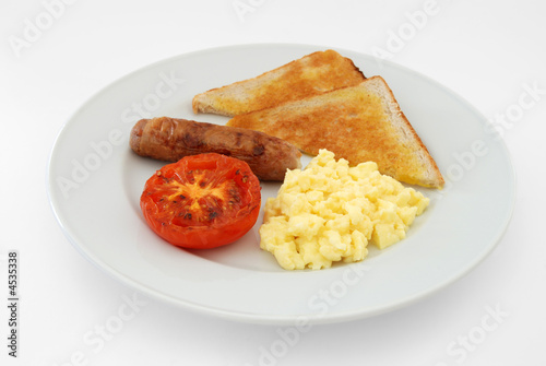 English Breakfast Of Scrambled Eggs Sausage Toast And Tomato Stock Photo Adobe Stock