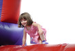 © BCFC - Cute little girl playing on a bouncy castle