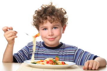 Boy eating pasta