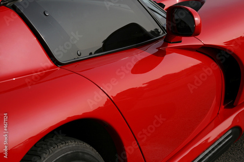 Photo: side of red exotic car side of red exotic car