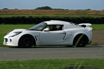 Poster - white sportscar on the track